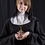 Image of Aiden Hamilton in a nun outfit